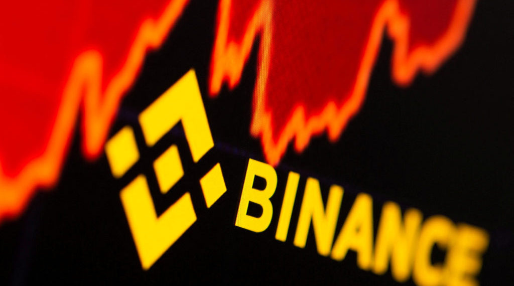 FILE PHOTO Binance logo and stock graph are displayed in this illustration taken | 動區動趨-最具影響力的區塊鏈新聞媒體 幣安傳大砍育兒津貼、健身補助..員工福利沒了,還有下波裁員潮?